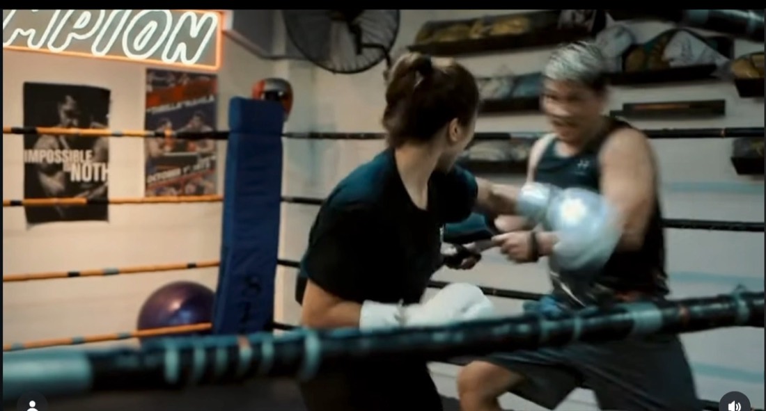 Boxing pad work in the ring