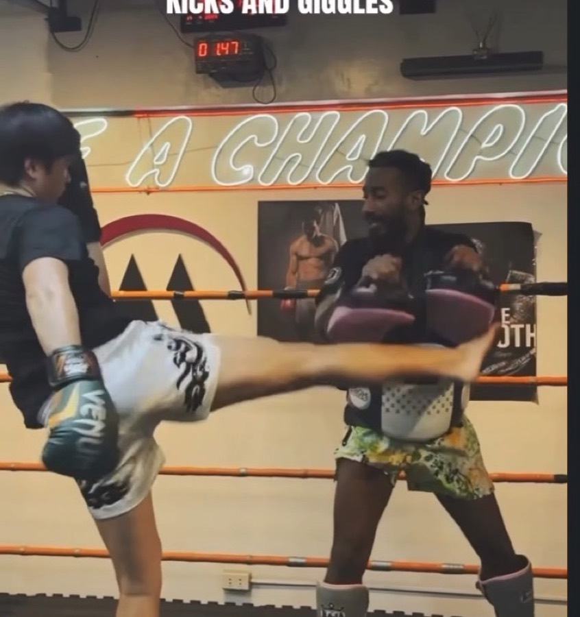 Muay Thai pad work in the ring